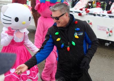 Cllr. Adam Cooper handing out candy during the Christmas parade